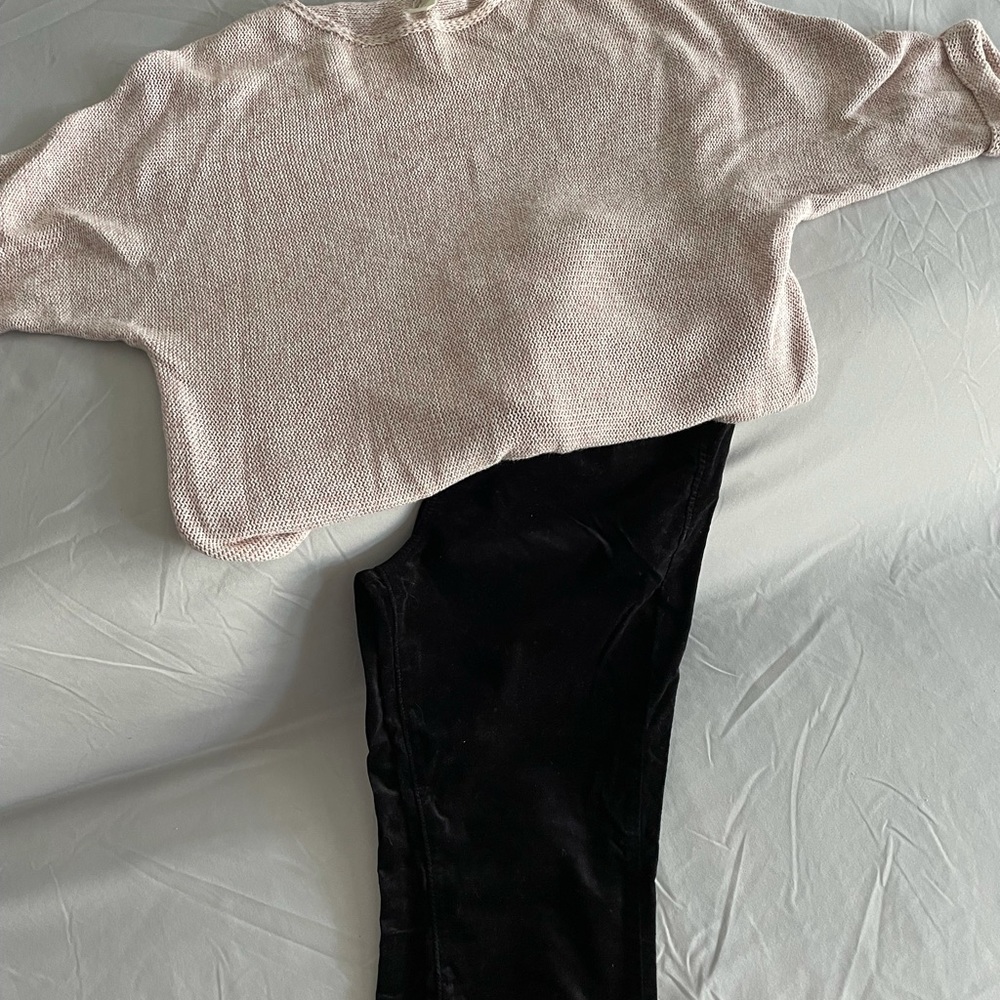 A lot of black pants and 4 tops